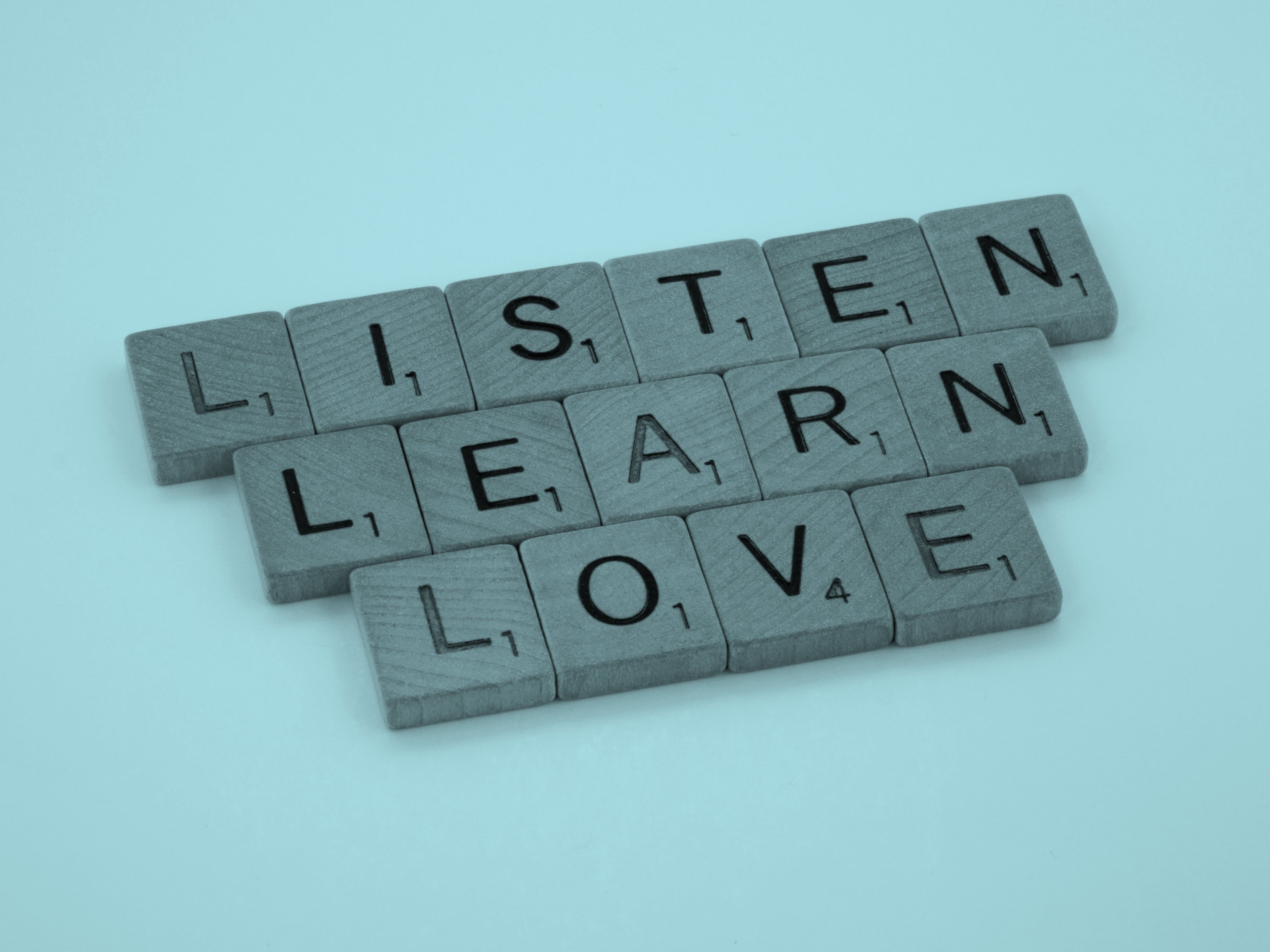 Letters arranged to spell, Listen Learn Love